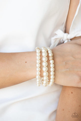 Here Comes The Heiress - Gold and pearl bracelet Paparazzi Accessories